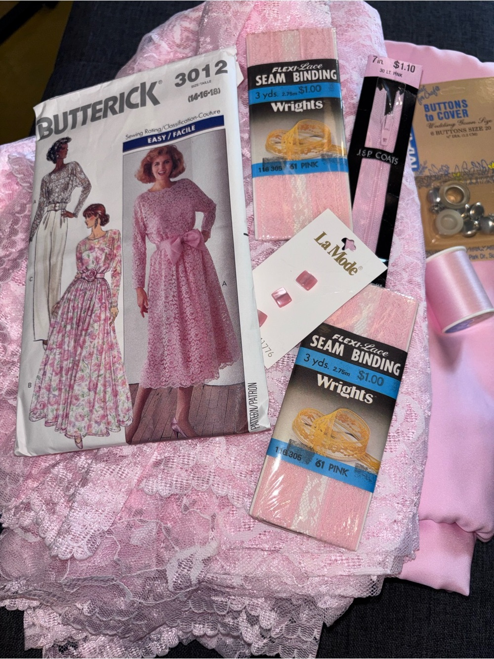 Fabric lot. Pink fabric and pink lace.